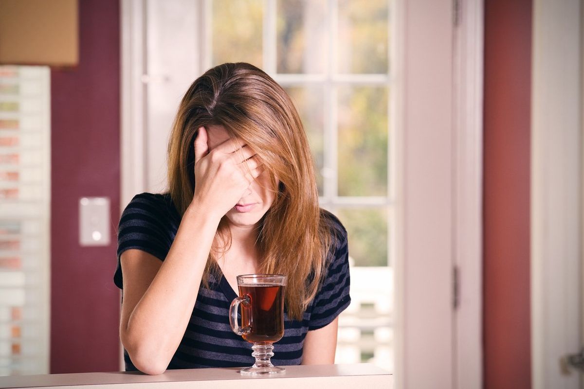 https://www.healthywomen.org/media-library/a-woman-covering-her-face-dealing-with-alcohol-induced-anxiety-drinking-tea.jpg?id=33640781&width=1200&height=800&quality=85&coordinates=0%2C0%2C0%2C0