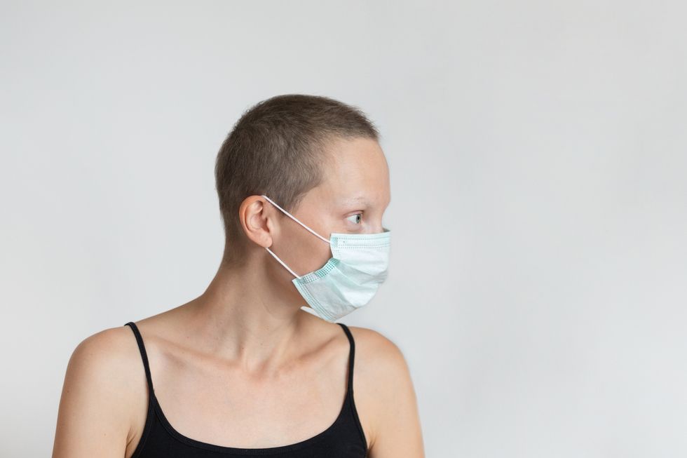 cancer patient woman wearing protective facial mask