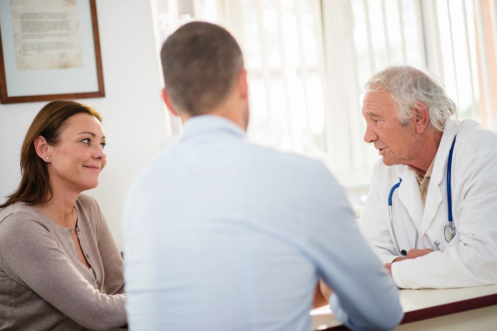 couple talking with their doctor about contraception options for women over 40