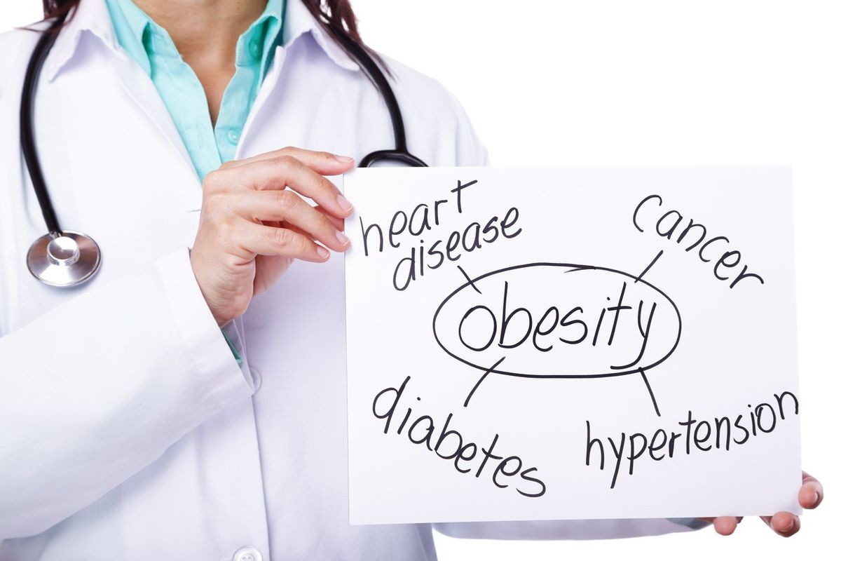 doctor showing the consequences of obesity