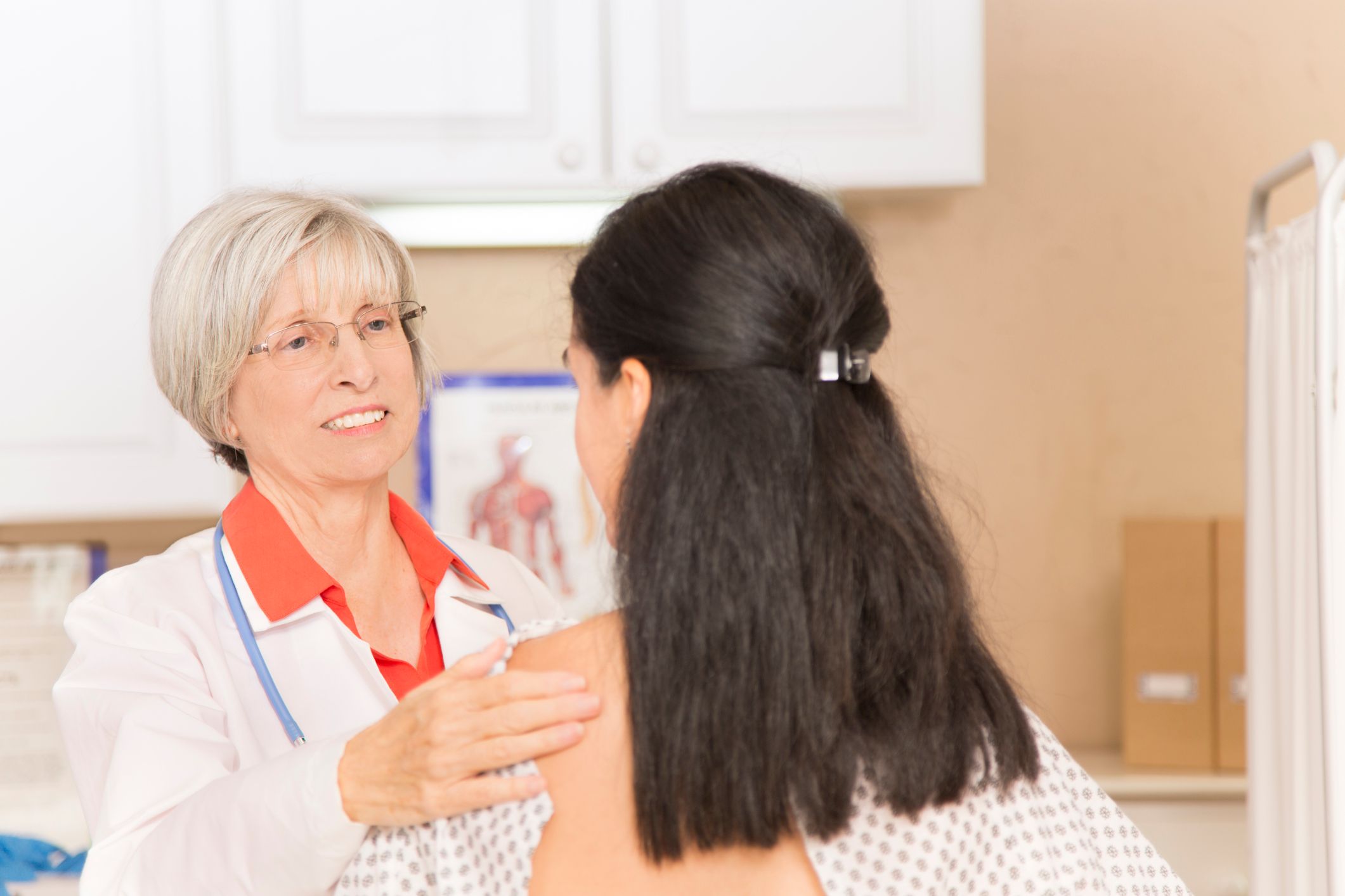 Woman receiving breast exam