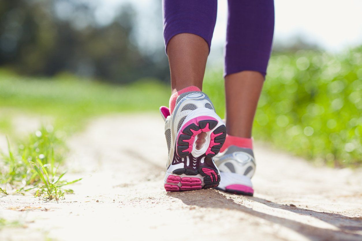 feet of an athlete running at the park.