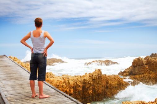 woman with alopecia looking at the ocean