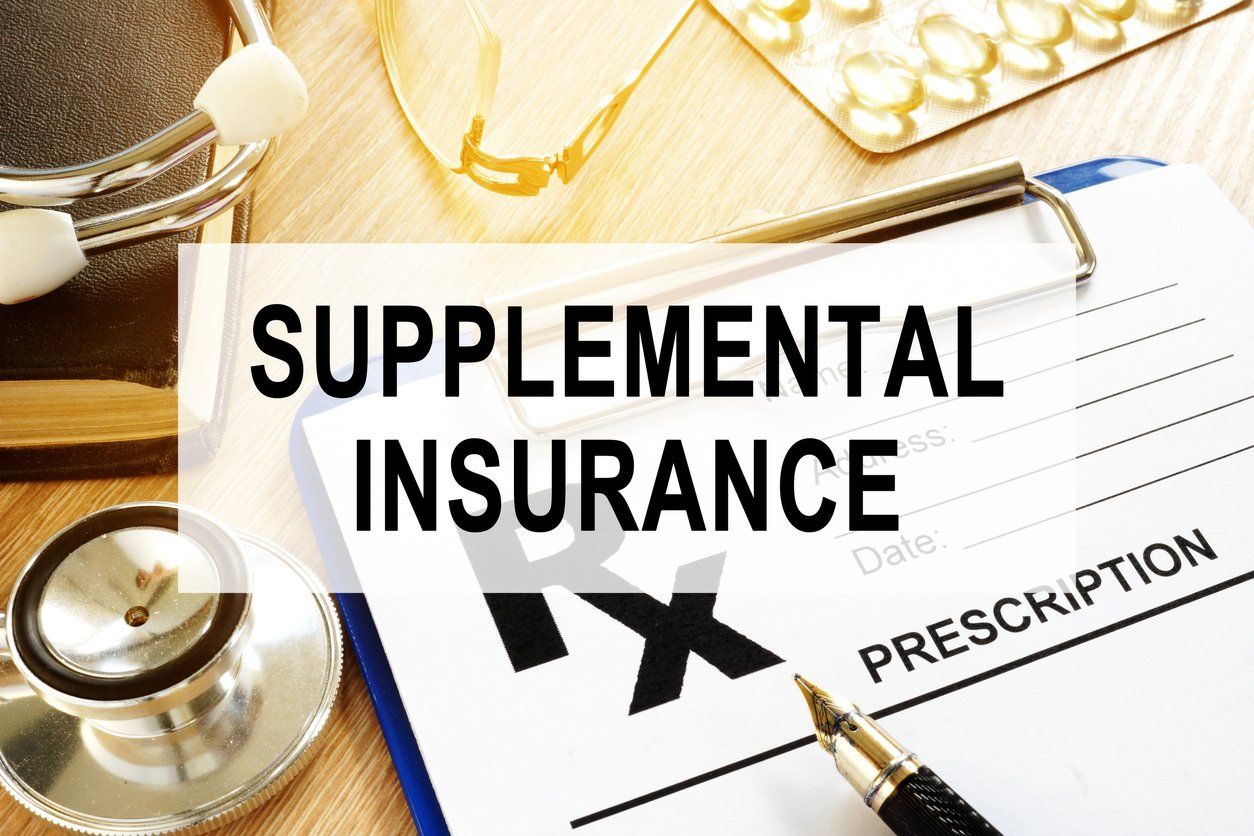 Supplemental Insurance. Prescription form and stethoscope.