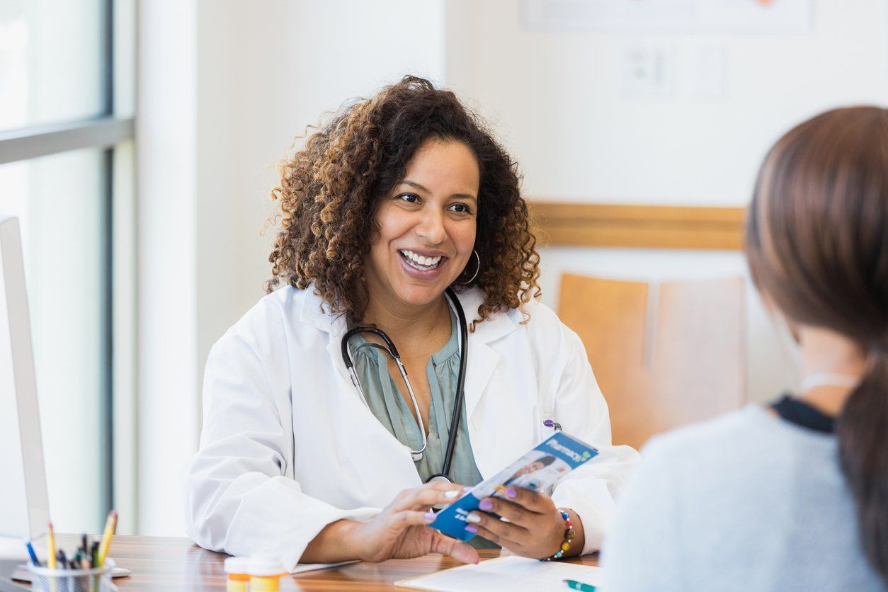 Doctor talks with patient about healthcare options