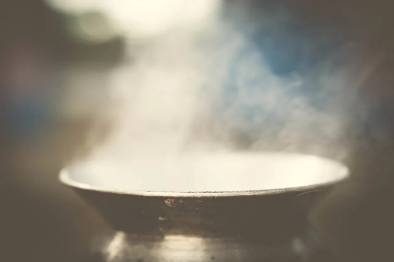 Pot and vapor steam flowing up of cooking