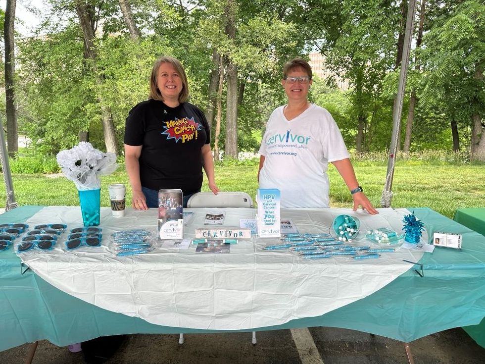 Karen at a table promoting cervivor group