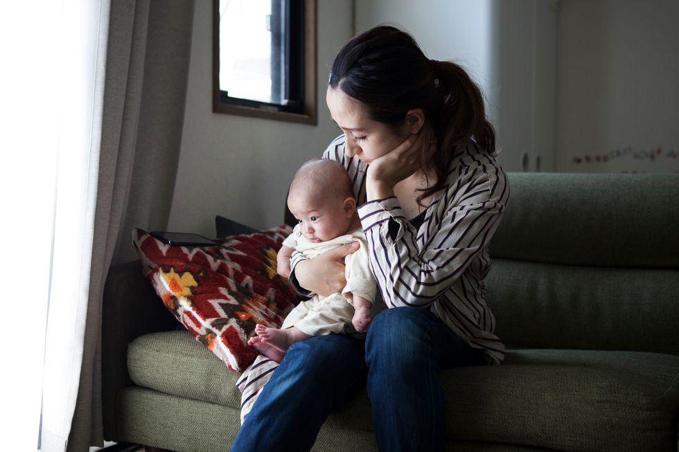 mother holding baby suffering from postpartum anxiety