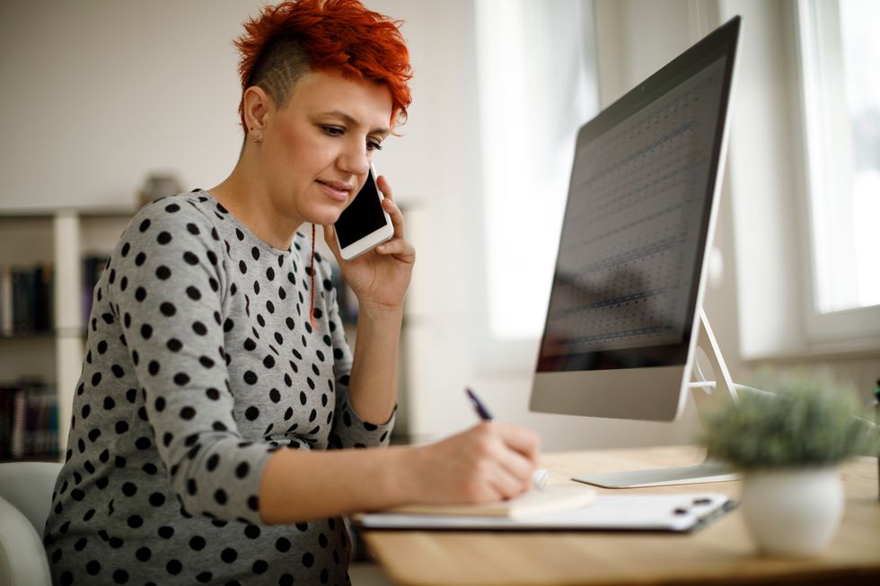 Pregnant woman working from home office