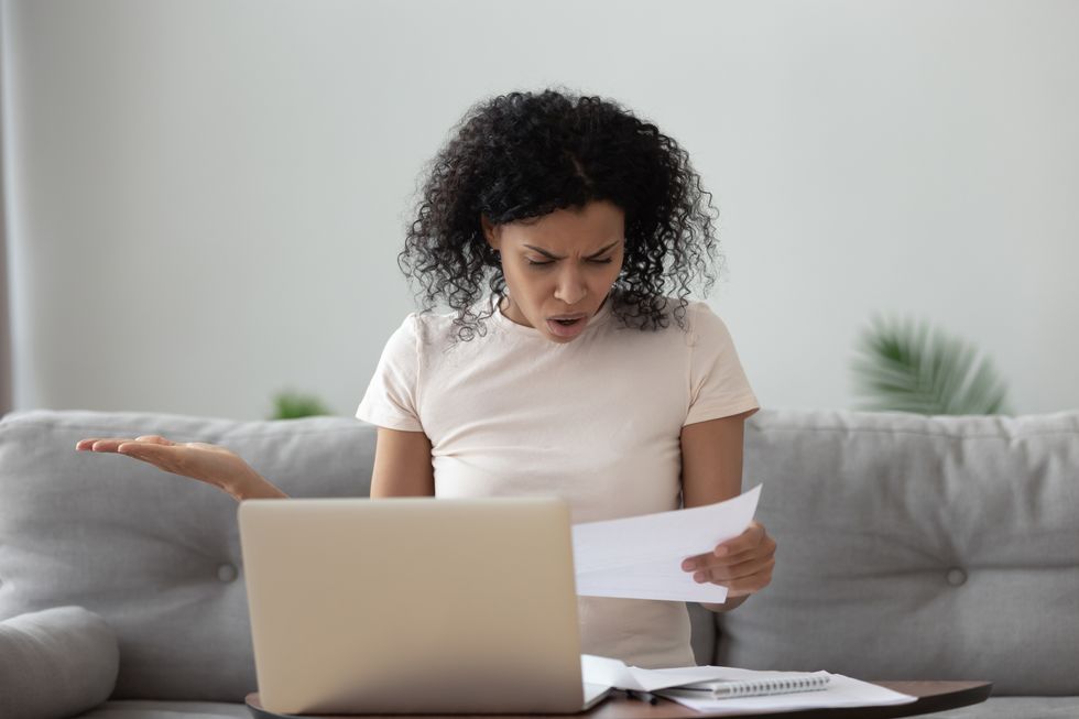 stressed woman receiving a surprise medical bill