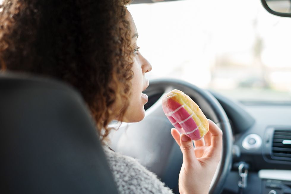 woman eating a donut