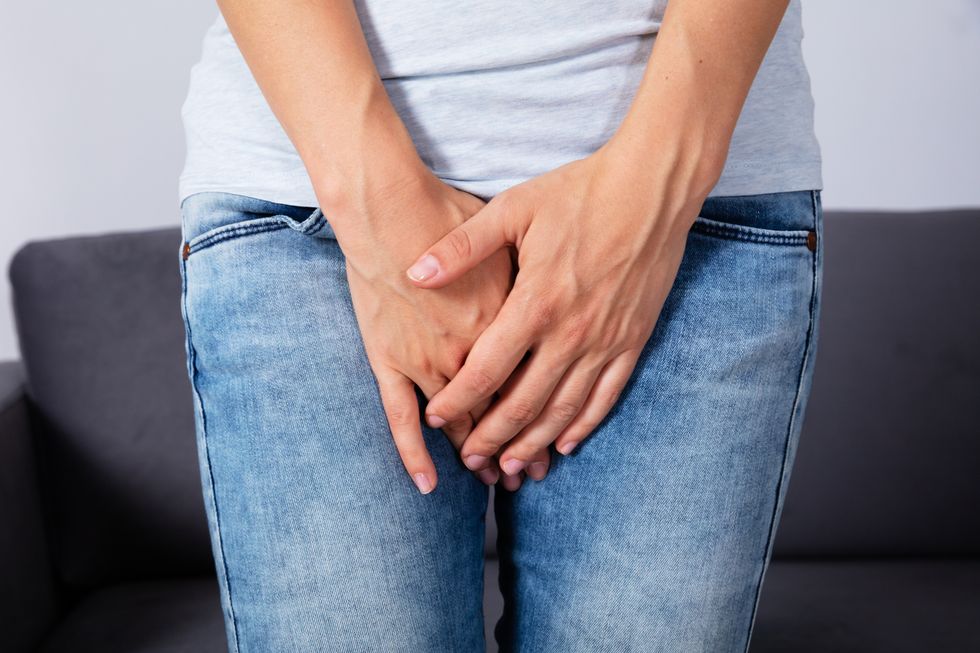 Woman's Hand Pressing Her Crotch